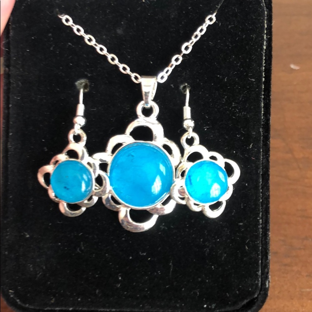 Matching silver and blue necklace and earrings
